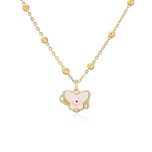 Detailed view of butterfly pendant necklace with evil eye motif and gold beaded chain