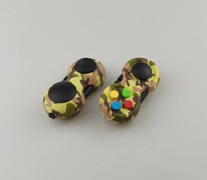 Close-up of camouflage stress relief controllers with colorful silicone buttons and joystick