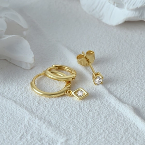 Macro shot of S925 sterling silver hallmark on golden devil's eye earring set