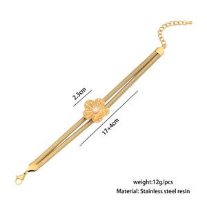 Close-up of golden flower charm on double-layer snake chain with size parameters
