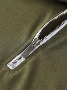 Army green polo shirt featuring a high-quality silver metal zipper and knit fabric texture