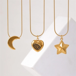 Minimalist gold snake chain necklaces with crescent moon, heart, and star pendants