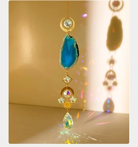 Detailed suncatcher with blue agate slice, golden moon, and crystal prism rainbow maker