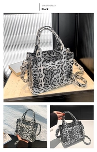 Detail of leopard print tote bag with dual handles, adjustable strap and outer pocket