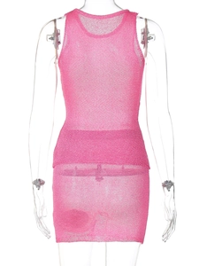 Rear view of pink knitted mesh two-piece set showing sheer texture and mini skirt detail