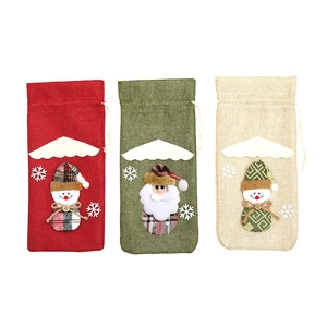 Three-piece burlap Christmas wine bottle gift bags with Santa and snowman designs