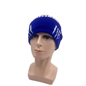 Detail of royal blue knitted beanie featuring a white skeleton hand bone print
