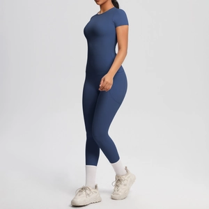 Detail of dark blue yoga set showing side pocket on high-waist leggings and slim-fit tee
