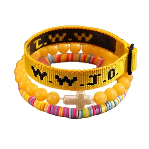 Detailed view of WWJD woven band, cross charm bead and colorful polymer clay bracelet set