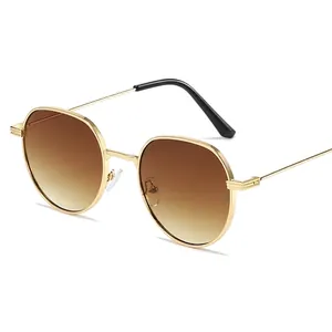 Classic retro sunglasses with gold metal frame and brown gradient lenses for a stylish look