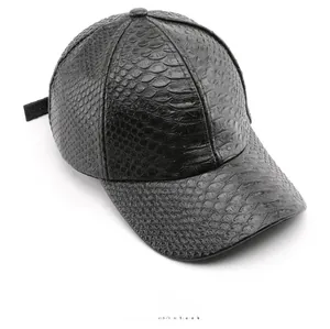 Top view of black faux leather baseball cap with detailed crocodile skin texture