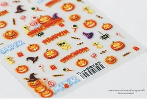 Macro detail of Halloween 5D nail art stickers with pumpkin, ghost and skull motifs