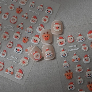 3D Christmas nail stickers featuring Santa and reindeer with embossed texture details