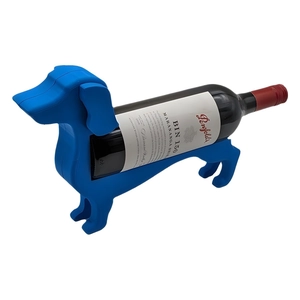 Creative blue dachshund wine bottle holder stand made of durable resin on white background