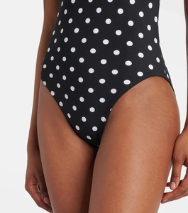 Detail view of black polka dot swimsuit featuring high-cut leg and smooth elastic fabric