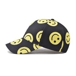 Black cotton baseball cap with yellow smiley face print and adjustable strap