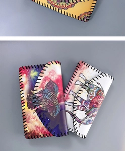 Detailed close-up of bohemian style shoulder bags with colorful elephant patterns