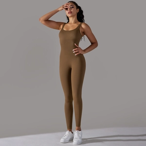 Detailed texture of seamless ribbed brown yoga jumpsuit with athletic bodycon fit