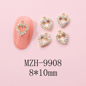 Detail of heart nail charm with colorful rhinestones and gold alloy 8x10mm size