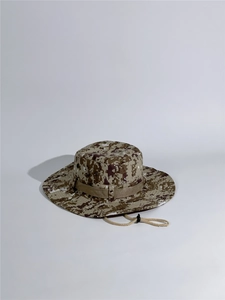 Detail view of the digital camouflage pattern and adjustable chin strap on the sun hat