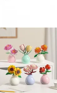Detail view of artificial brick flower set including roses and tulips in small colorful vases