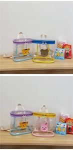 Detail view of transparent jelly backpacks with cute cartoon animal patches and zip closure