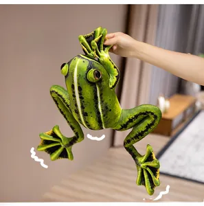 Detailed realistic green frog plush toy with striped pattern held in hand