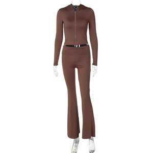 Detail view of brown two-piece set featuring a zip-up hoodie and high-waisted flared pants