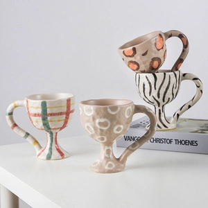 Handmade ceramic goblets with hand-painted zebra and leopard patterns for dessert