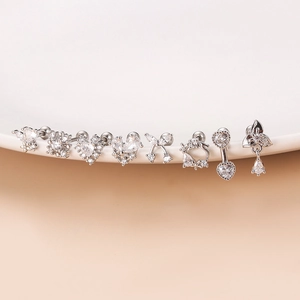 Set of 8 silver stainless steel stud earrings with heart and bow zirconia designs