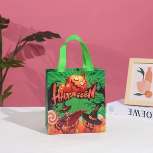 Detailed view of green Halloween tote bag with pumpkin prints and festive text design
