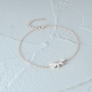 Detail of 925 silver bracelet with marquise zircon crown design and lobster clasp closure