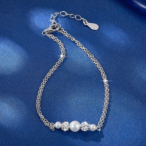 Detailed macro shot of S925 silver double-layer bracelet with pearls and crystal balls