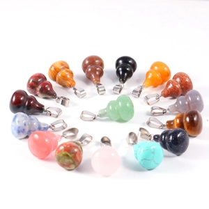 Gourd-shaped jade and agate pendants in various colors arranged in a heart shape