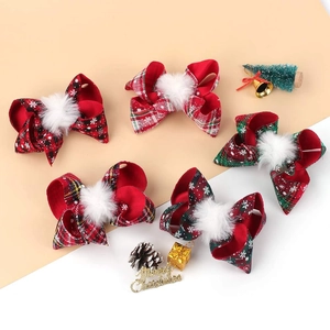 5-piece set of Christmas bow hair clips in red and green plaid with plush pom-poms