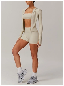 Three-piece yoga set with zip hoodie, sports bra and high waist shorts in sand color