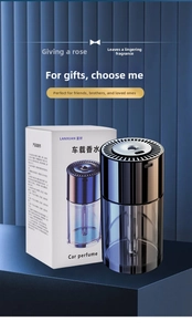 Minimalist cylindrical car perfume spray with matte grey reservoir and black vent detail