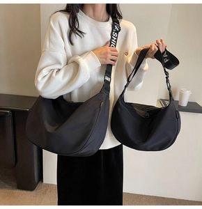 Visual size comparison of large and small black waterproof oxford nylon dumpling bags