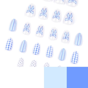 Blue bow almond press-on nails with blue and white gingham and striped patterns