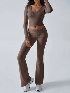 Detail showing brown ribbed knit long-sleeve crop top and flared leggings two-piece set