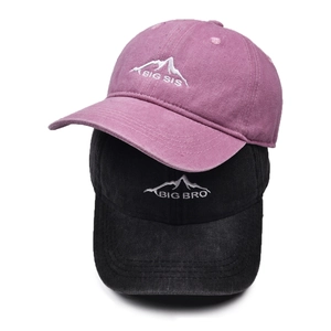 Matching set of washed cotton baseball caps with Big Sis and Big Bro mountain embroidery
