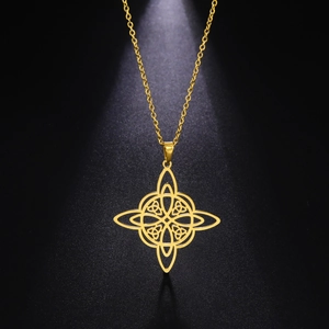 Macro shot of gold stainless steel Celtic knot pendant with hollow intricate details