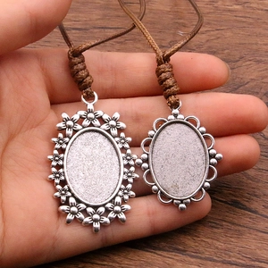 Vintage silver pendant trays with brown cord for DIY sweater necklaces