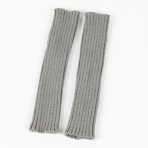 Detailed view of grey knitted arm warmers with classic ribbed texture and elastic material