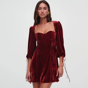 Sexy dark red velvet mini dress with puff sleeves and tie cuffs on white background