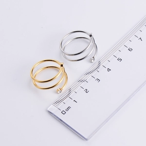 Three-layer spiral open rings in gold and silver with rhinestones and size reference