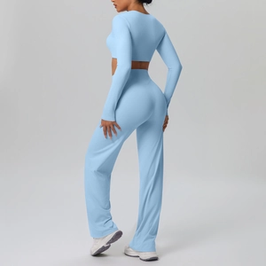 Back side view of light blue two-piece sports set showing slim fit top and wide-leg yoga pants