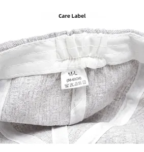 Detail view of cotton linen newsboy hat interior with sweatband and size label