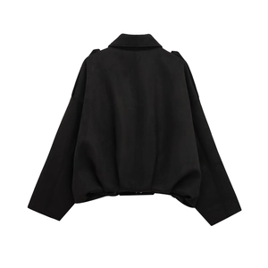 Back view of a black bomber jacket with soft suede-like texture and loose-fit silhouette