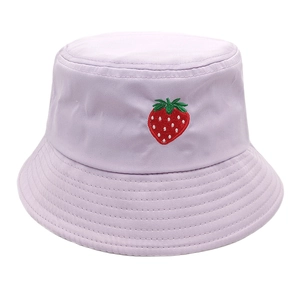 Close-up of strawberry embroidery detail and cotton twill stitching on purple bucket hat